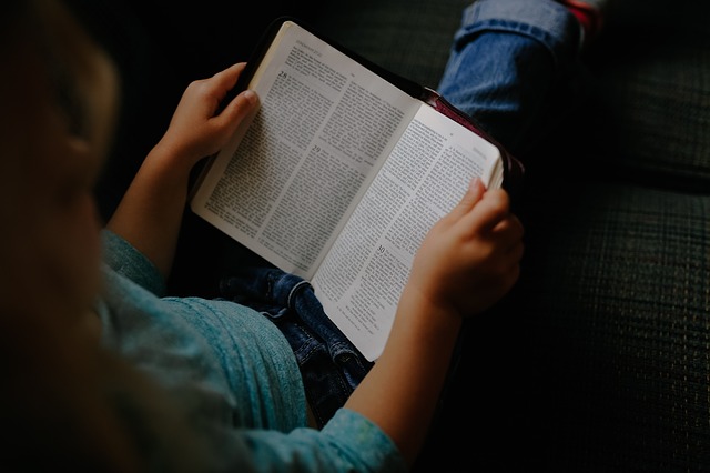 Child Reading a Bible